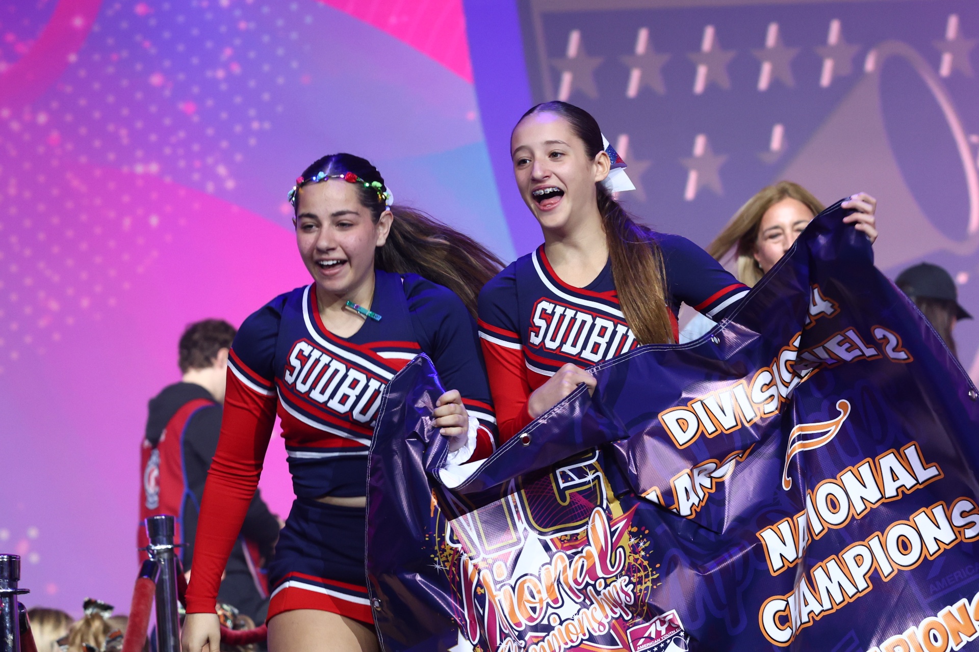 Youth cheerleading team performing at competition